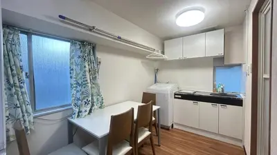 a kitchen with a table and chairs and a window at Tokyo Skytree\u591c\u666f 5\u5957\u885b\u6d74 5\u9593\u5957\u623f \u5730\u94355\u5206 \u76f4\u9054\u8868\u53c3\u9053 \u6a5f\u5834 \u6d17\u8863\u6a5f V444D in Tokyo