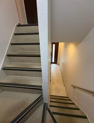 a staircase in a house with a stair case at Elle Maison\u5927\u68ee 203 in Tokyo