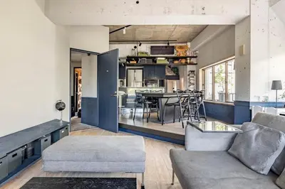 a living room with a couch and a table at Aoyama Roppongi Fully renovated Japanese house in Tokyo