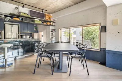 a dining room with a table and chairs at Aoyama Roppongi Fully renovated Japanese house in Tokyo