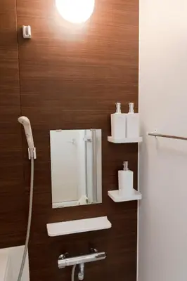 a bathroom with a mirror and a sink at CASA201 1-minute walk from the station, Asakusa, Akihabara, Ginza, Tsukiji, Toyosu, Shinjuku, Shibuya, Narita, Haneda, good access in Tokyo