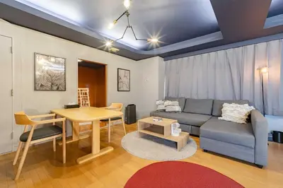 a living room with a couch and a table at LINKAGE STAY Chitose Funabashi in Tokyo