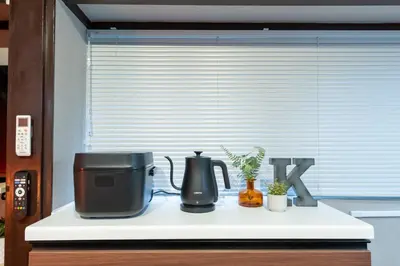 a coffee maker on a counter in front of a window at Kstyle Apartments KURI in Tokyo