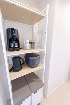 a kitchen shelving unit with a coffee maker on it at Bright Skytree View Apartment,6 Min Walk to Kinshicho Station in Tokyo