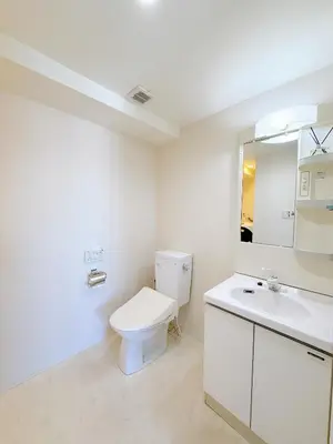 a white bathroom with a toilet and a sink at Bright Skytree View Apartment,6 Min Walk to Kinshicho Station in Tokyo