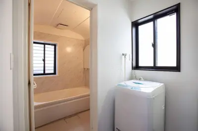 a bathroom with a tub and a toilet and a sink at Ks\u897f\u65e9\u7a32\u7530 2F in Tokyo