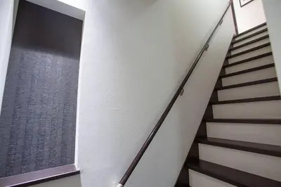 a staircase in a home with white walls and a window at Ks\u897f\u65e9\u7a32\u7530 2F in Tokyo