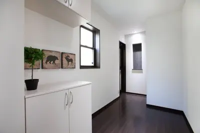 a kitchen with white cabinets and a window at Ks\u897f\u65e9\u7a32\u7530 2F in Tokyo