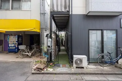 a building with bikes parked on the side of it at Ks\u897f\u65e9\u7a32\u7530 2F in Tokyo