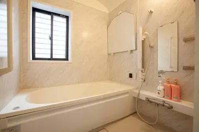 a bathroom with a tub and a sink and a mirror at Ks\u897f\u65e9\u7a32\u7530 2F in Tokyo