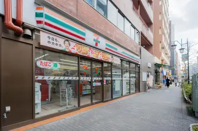 a store front of a building with signs on it at unito residence EBISU STATION North in Tokyo