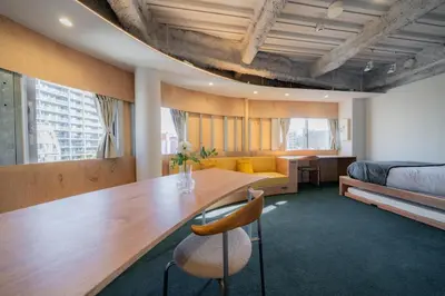 a room with a dining table and a bed at \u30ec\u30b8\u30fc\u30f3\u6075\u6bd4\u5bff in Tokyo