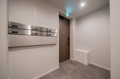 a kitchen with a stainless steel stove and a door at \u30ec\u30b8\u30fc\u30f3\u6075\u6bd4\u5bff in Tokyo