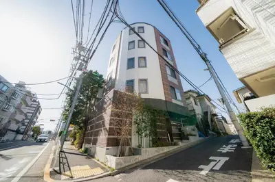 a tall building on a street with power lines at \u30ec\u30b8\u30fc\u30f3\u6075\u6bd4\u5bff in Tokyo