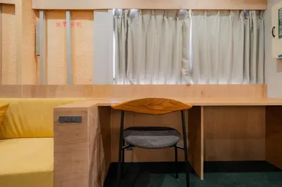 a desk with a chair next to a bed at \u30ec\u30b8\u30fc\u30f3\u6075\u6bd4\u5bff in Tokyo