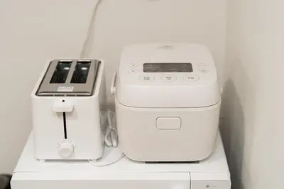 two appliances sitting on top of a shelf at NISHIKI Ryokan\u9326\u65c5\u9928 in Tokyo