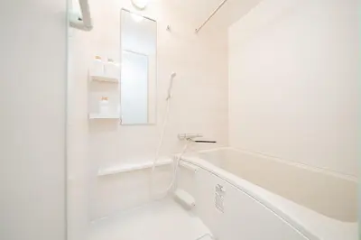 a white bathroom with a tub and a sink at NISHIKI Ryokan\u9326\u65c5\u9928 in Tokyo