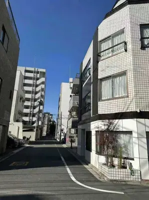 an empty street in a city with tall buildings at TOKYO AKATSUKI HOTEL - asakusa \u3042\u304b\u3064\u304d\u30db\u30c6\u30eb\u3042\u3055\u304f\u3055 in Tokyo
