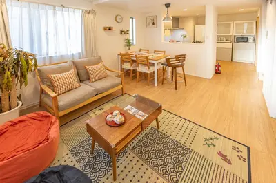 a living room with a couch and a table at Oshiage 3-chome Entire House Near Skytree in Tokyo