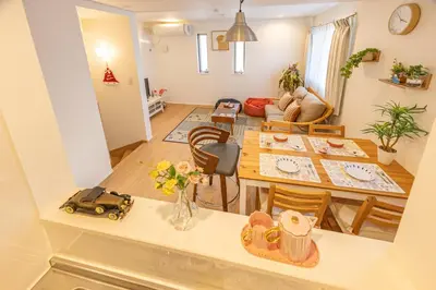 a kitchen and living room with a table and chairs at Oshiage 3-chome Entire House Near Skytree in Tokyo
