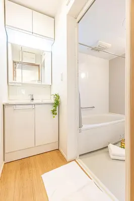a white bathroom with a tub and a sink at Oshiage 3-chome Entire House Near Skytree in Tokyo
