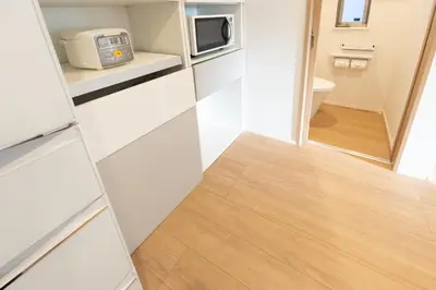 a small bathroom with a toilet and a microwave at Oshiage 3-chome Entire House Near Skytree in Tokyo