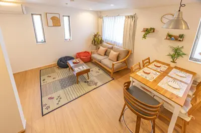 a living room with a table and a couch at Oshiage 3-chome Entire House Near Skytree in Tokyo