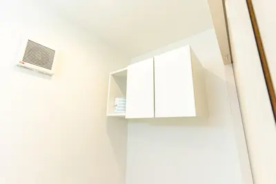 a bathroom with a white cabinet and a window at Spacious Skytree Stay, 8 Guests, Asakusa 11 mins, Modern Renovation, 8-min Walk to Station in Tokyo