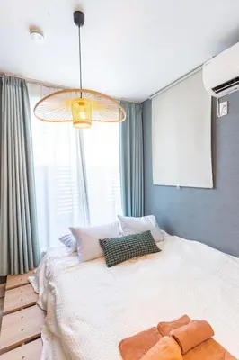 a bedroom with a large bed with a large window at Spacious Skytree Stay, 8 Guests, Asakusa 11 mins, Modern Renovation, 8-min Walk to Station in Tokyo