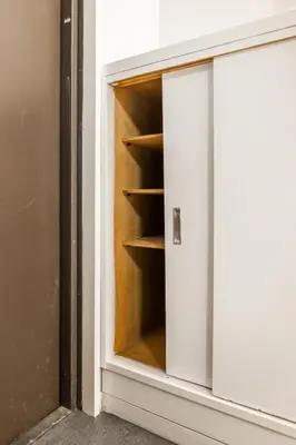 an open cabinet door in a room at 8 min to Ikebukuro, 6 min walk from Yomachi Station, Max 2 people, Straight to Tokyo, Shinjuku, Shibuya, Ueno 302 in Tokyo
