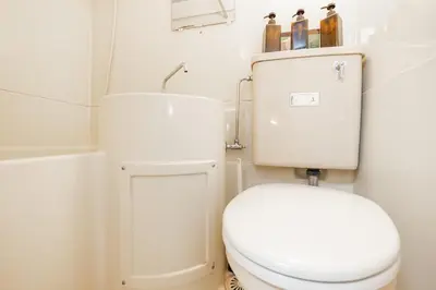 a bathroom with a white toilet and a sink at 8 mins walk to Ikebukuro, 6 mins to Kanamecho Station, Max 2 people, Direct access to Tokyo, Shinjuku, Shibuya, Ueno 503 in Tokyo