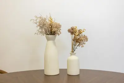 two white vases sitting on a table with flowers at 8 mins walk to Ikebukuro, 6 mins to Kanamecho Station, Max 2 people, Direct access to Tokyo, Shinjuku, Shibuya, Ueno 503 in Tokyo