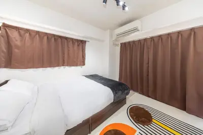 a bedroom with a white bed and a window at 8 mins walk to Ikebukuro, 6 mins to Kanamecho Station, Max 2 people, Direct access to Tokyo, Shinjuku, Shibuya, Ueno 503 in Tokyo
