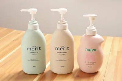 three bottles of hair products sitting on a wooden table at \u8c4a\u6d32\u671d\u51ea\u306e\u5bbf in Tokyo