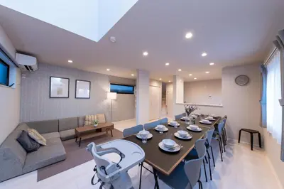 a dining room and living room with a table and chairs at Seven's Inn Takaramachi in Tokyo