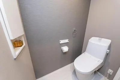 a bathroom with a white toilet in a stall at Seven's Inn Takaramachi in Tokyo