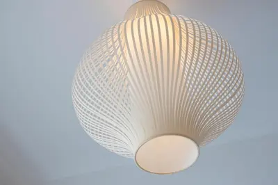 a light fixture that looks like a shell at \u3077\u3075\u304b\u9580\u524d\u4ef2\u753a Pufuka Monzennakacho in Tokyo