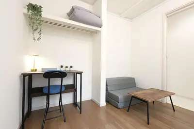 a room with a desk and a chair and a table at jjn\u4ef2\u753a201 in Tokyo