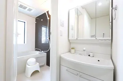 a white bathroom with a sink and a toilet at jjn\u4ef2\u753a201 in Tokyo