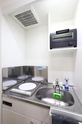a kitchen with a sink and a microwave at jjn\u4ef2\u753a201 in Tokyo