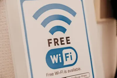 a sign that reads free wifi wifi is available at Setagaya Quiet Residential Apartment203 in Tokyo