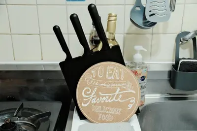 apron with a bottle of wine on a kitchen counter at Setagaya Quiet Residential Apartment203 in Tokyo