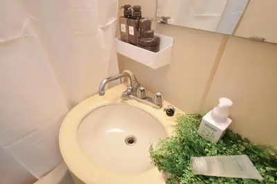 a bathroom with a toilet with a sink at Setagaya Quiet Residential Apartment203 in Tokyo