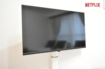 a flat screen tv hanging on a wall at Setagaya Quiet Residential Apartment203 in Tokyo