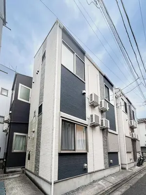 a black and white building on the side of a street at Triphome Otsuka 4 mins ShinOtsuka Station Loft bed in Tokyo