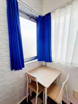 a table and two chairs in a room with a window at Triphome Otsuka 4 mins ShinOtsuka Station Loft bed in Tokyo
