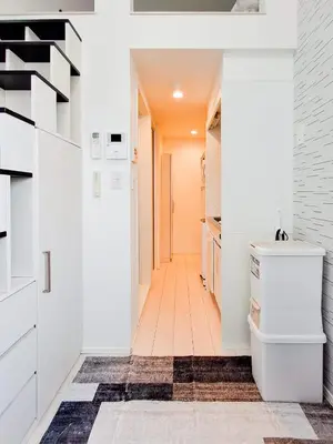 a bathroom with white cabinets and a hallway at Triphome Otsuka 4 mins ShinOtsuka Station Loft bed in Tokyo