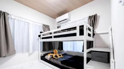 a bedroom with two bunk beds in a room at Kasai disney access hotel in Tokyo