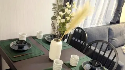 a table with a vase with flowers on it at Kasai disney access hotel in Tokyo