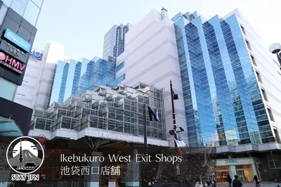 a tall building with blue windows in a city at M15 Aoba Great location within walking distance of Ikebukuro in Tokyo